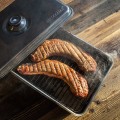 Balcony smokehouse with a thermometer