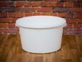 Round container, ladle